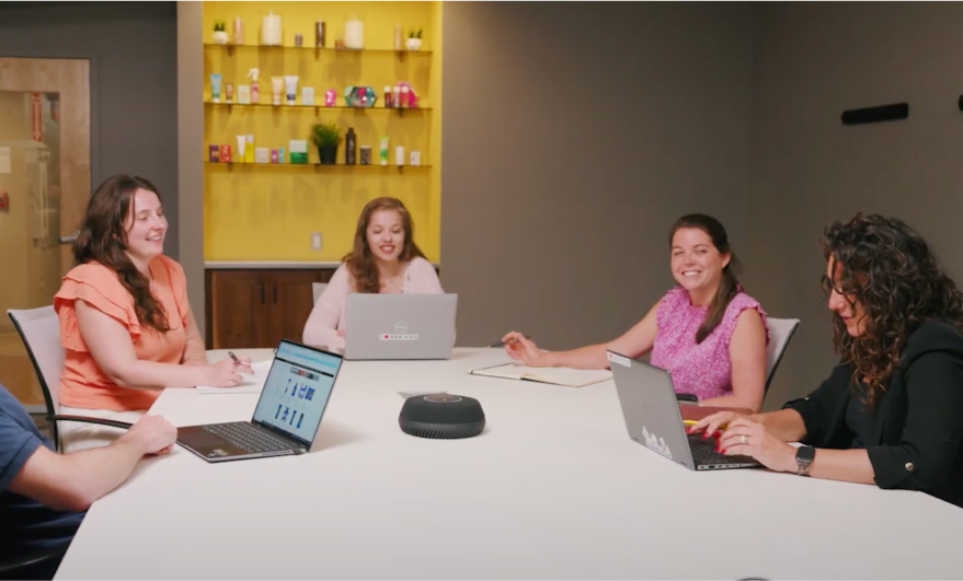A group of employees in a meeting